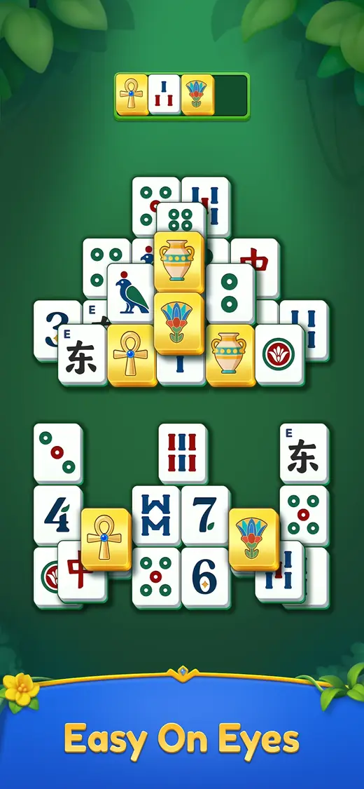 Ecrã de Pyramid Mahjong com a frase Easy On Eyes e peças douradas com jarro, ankh e flor de lótus